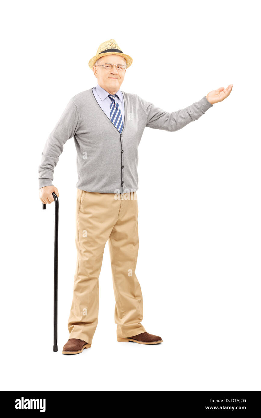 Full length portrait of an old man with cane gesturing with hand Stock Photo