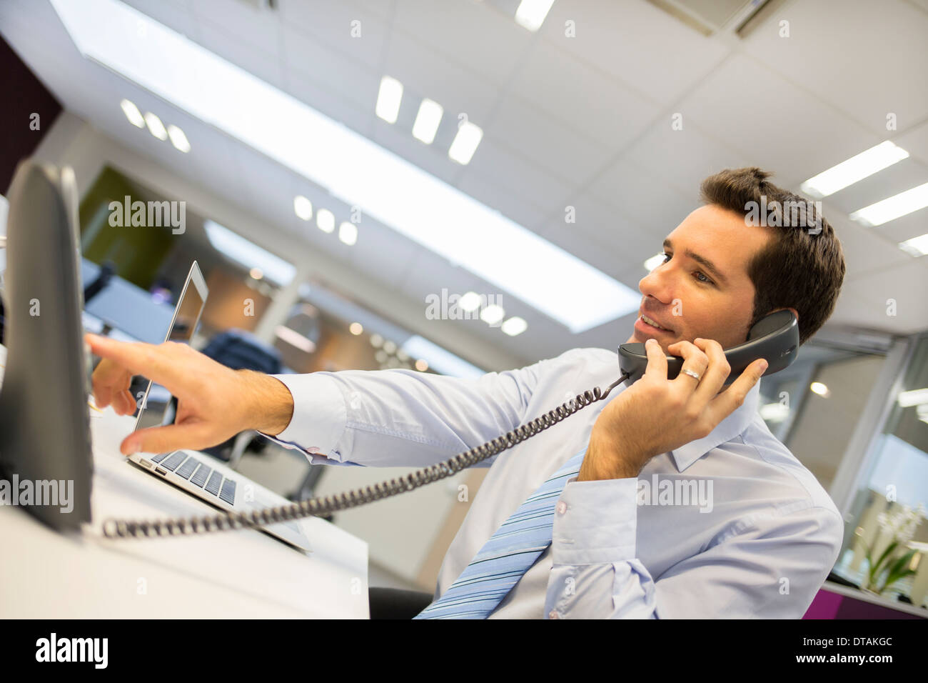 Businessman on phone in startup Stock Photo