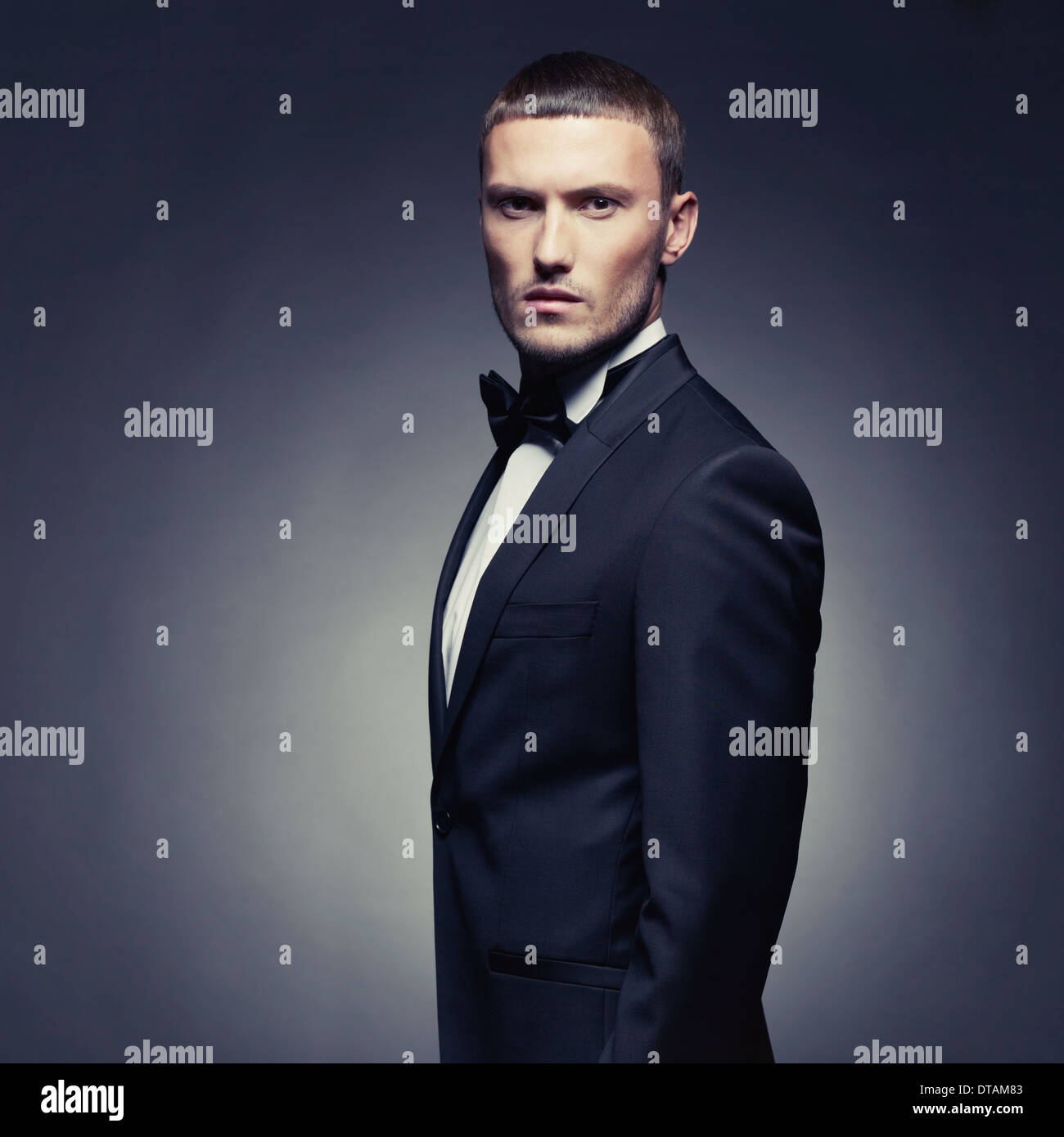 Portrait of handsome stylish man in elegant black suit Stock Photo - Alamy