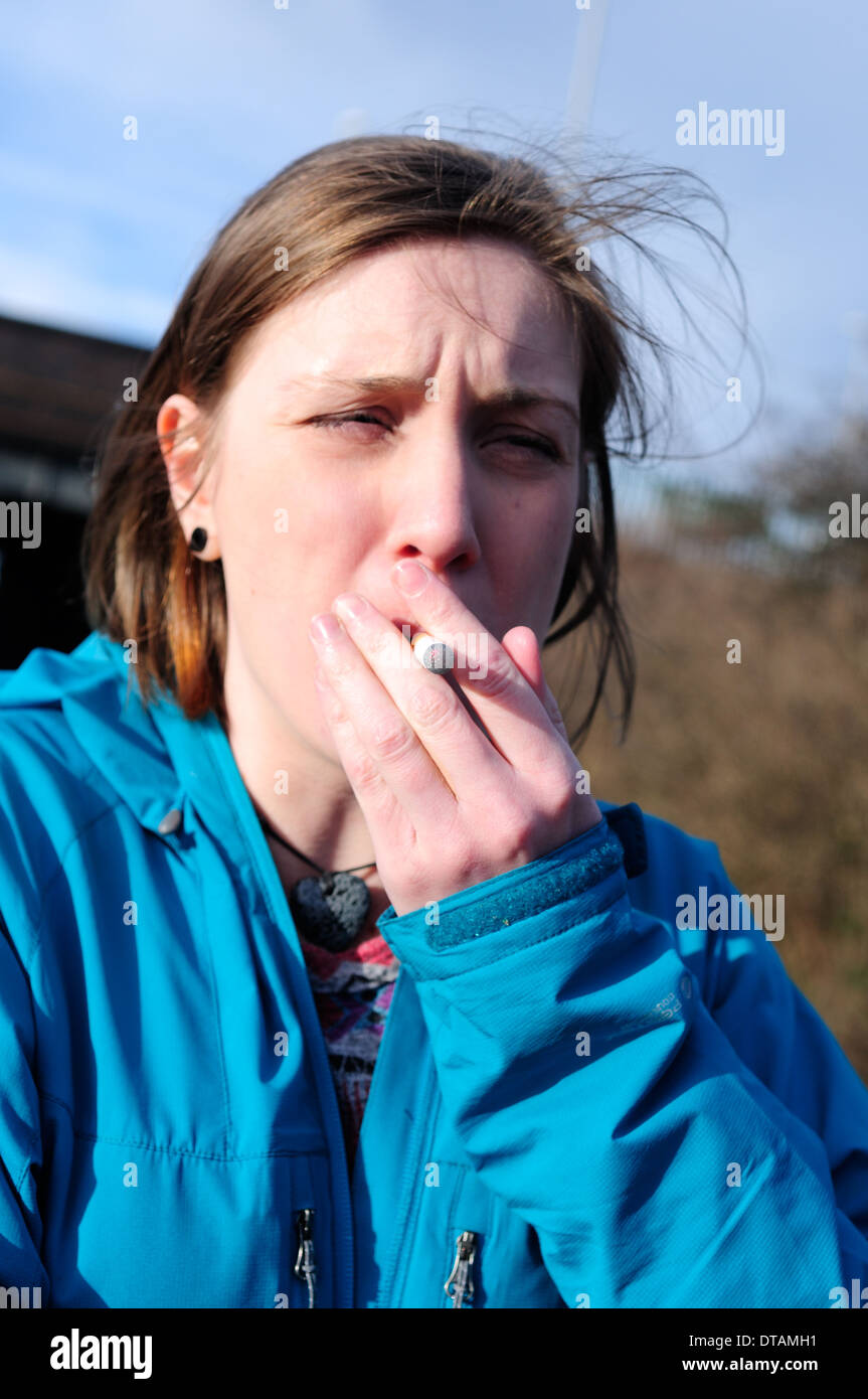 Young Women Smoking Electronic Cigarette. Stock Photo