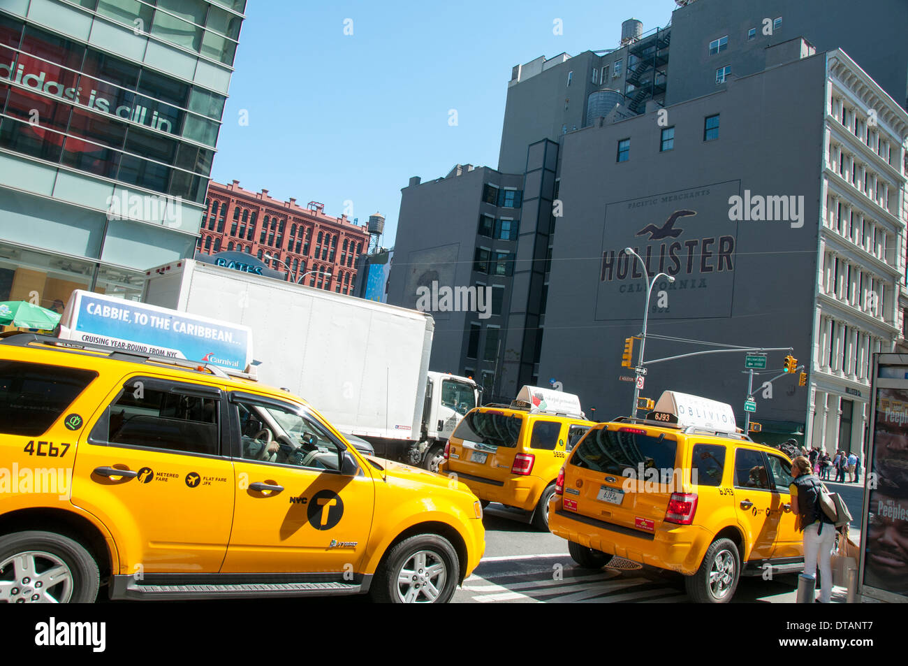 Yellow cabs on Broadway in Soho, Manhattan New York City, USA Stock Photo