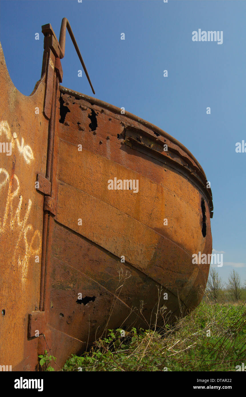 Rusting barge next to the canal at Port Dundas in Glasgow, Scotland Stock Photo