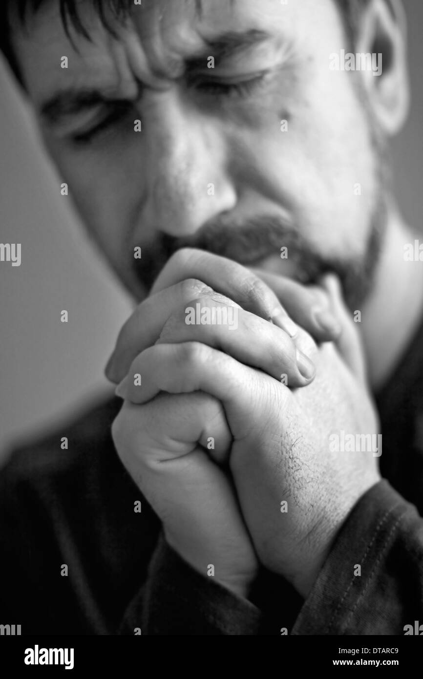 man closed his eyes to pray Stock Photo Alamy