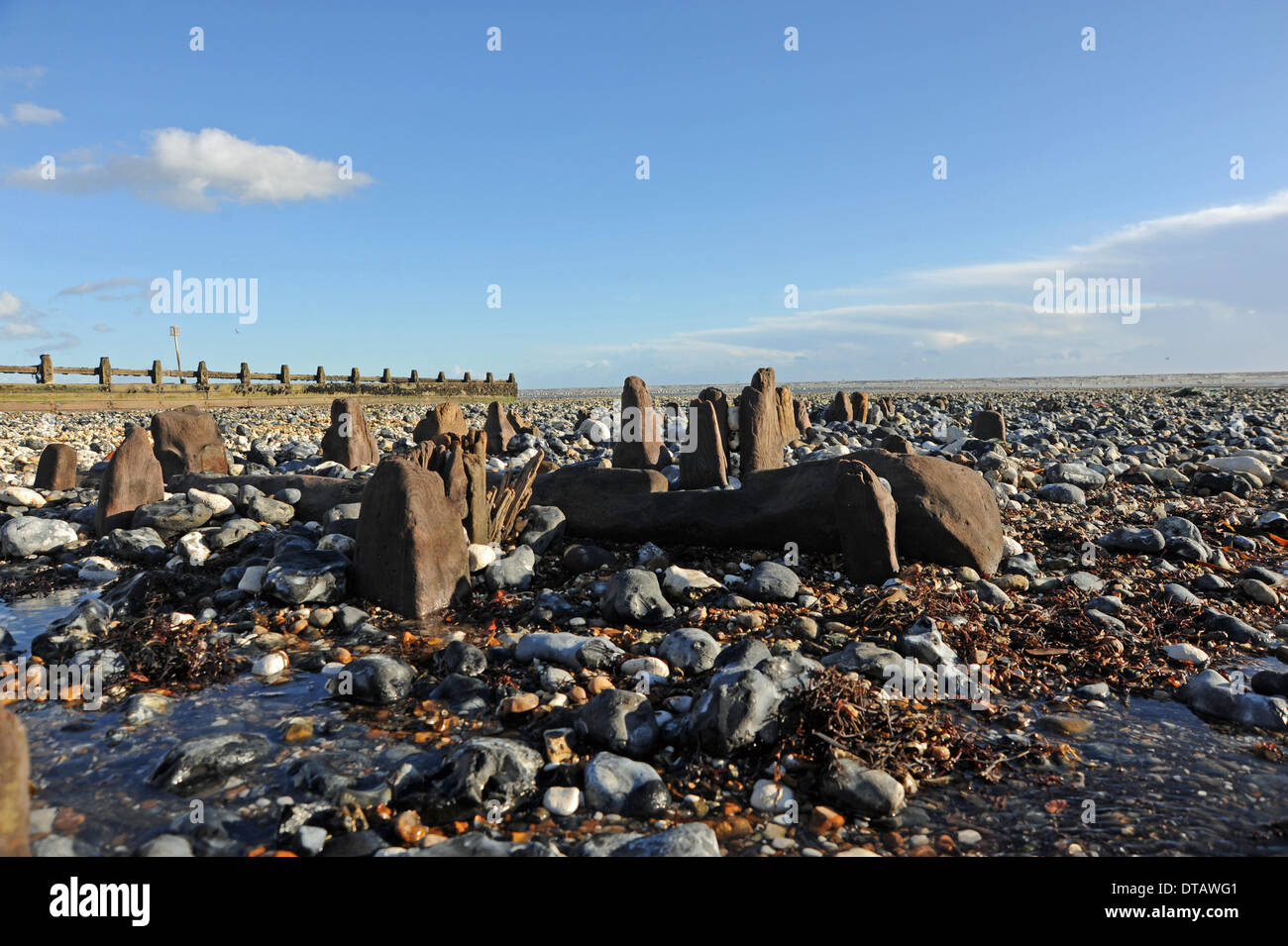 The recent storms and high tides have unearthed old World War 2 sea defences along the beaches at Ferring near Worthing UK Stock Photo