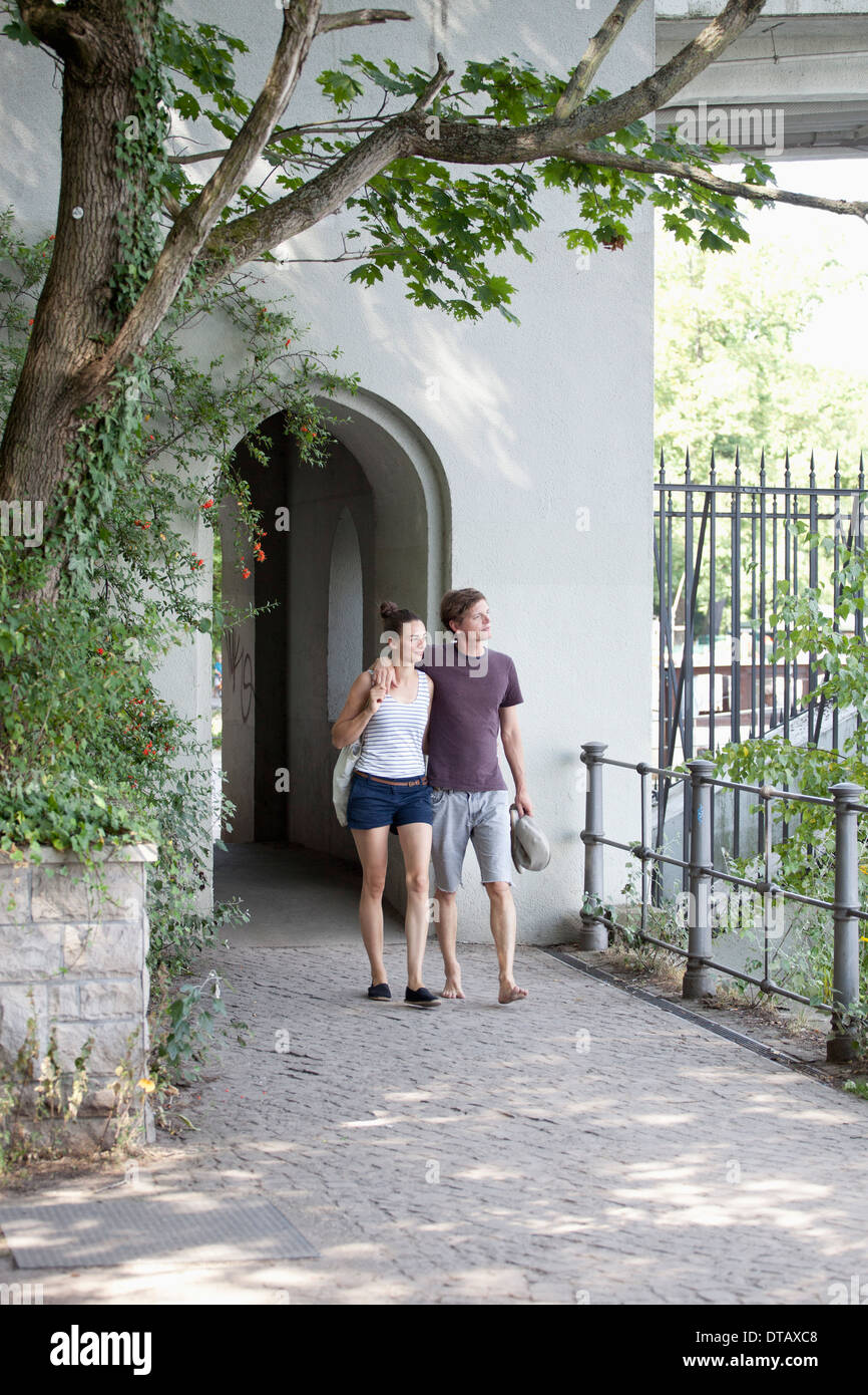 Two young women walking arm hi-res stock photography and images - Alamy