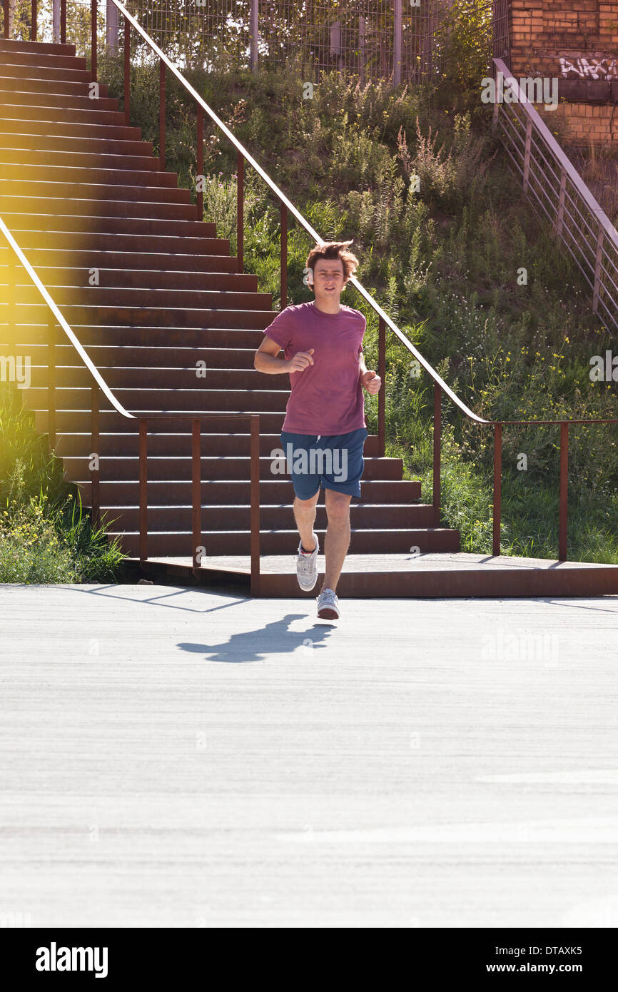 Mid adult man jogging Stock Photo