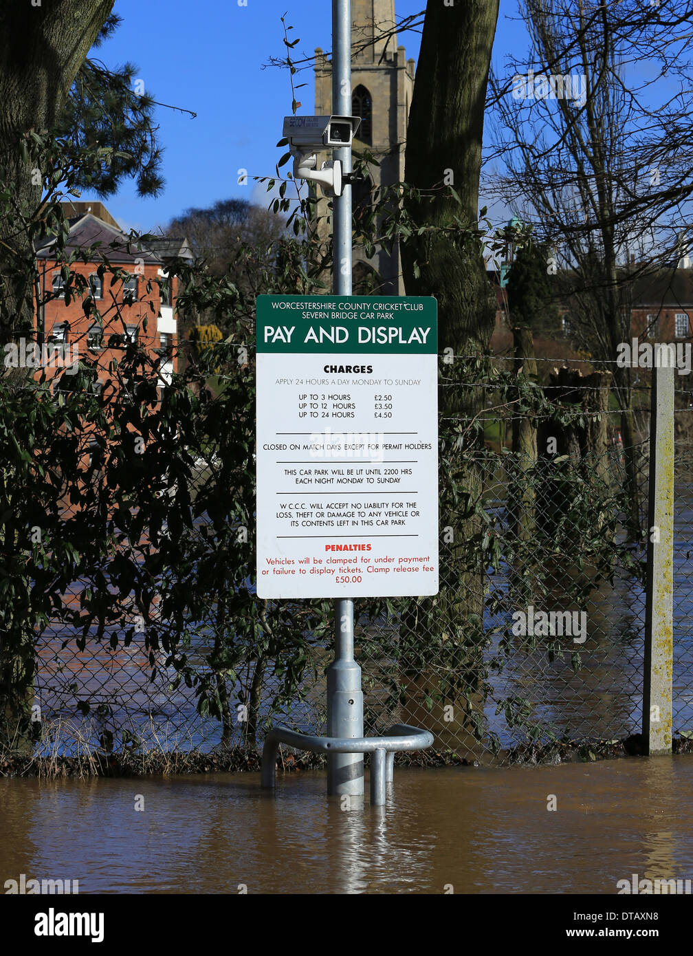 A car parking scale of charges sign at flooded Worcestershire County Cricket club. Presumably  the cost of mooring your vehicle? Stock Photo