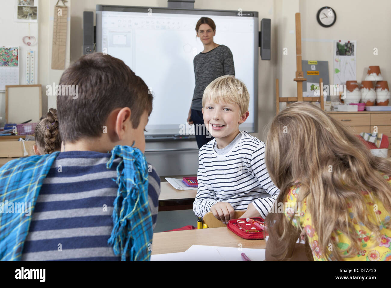 Boy and teacher in classroom hi-res stock photography and images - Alamy