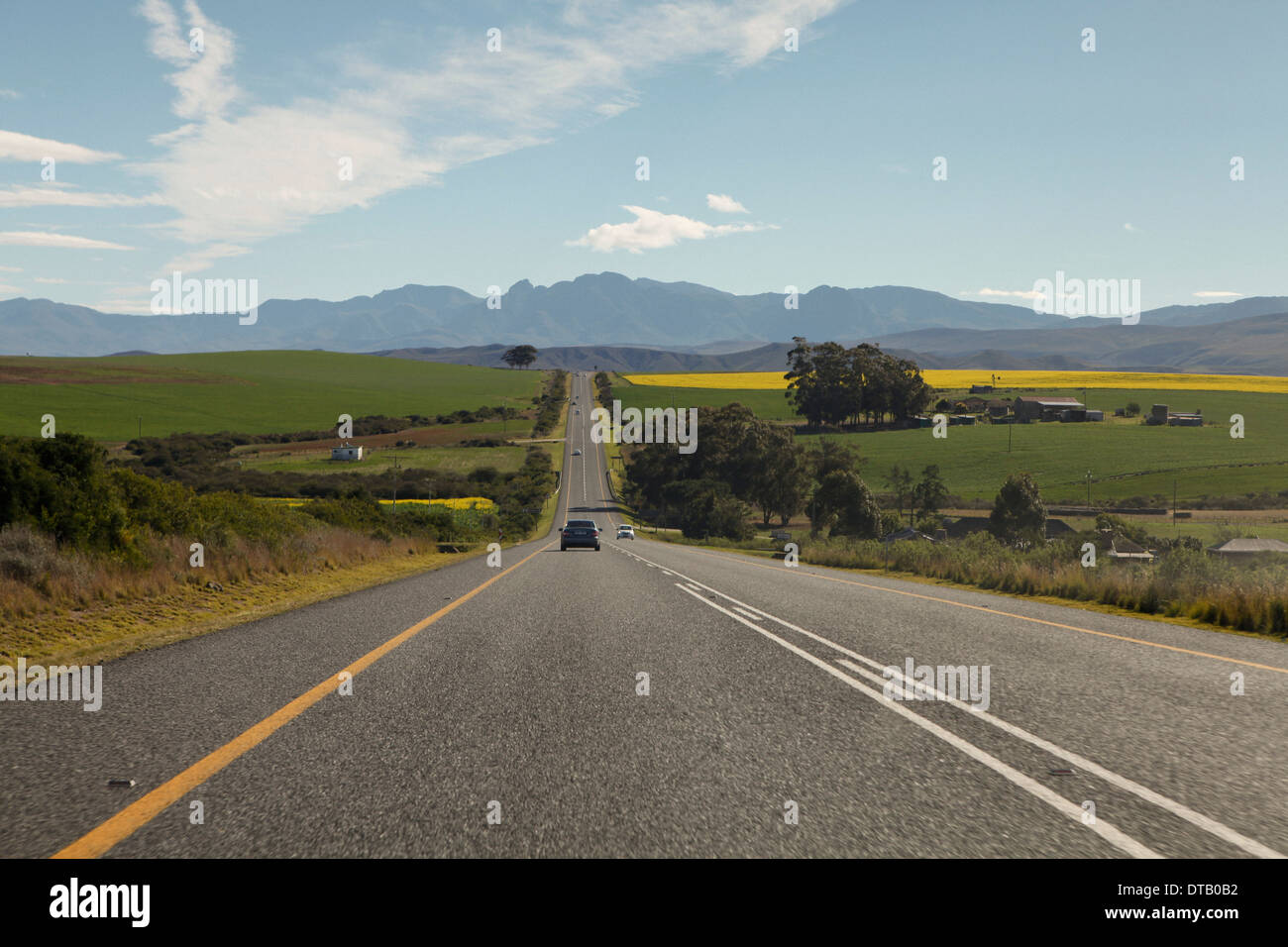 Cars on a road leading to the Riviersonderend Mountains, South Africa Stock Photo
