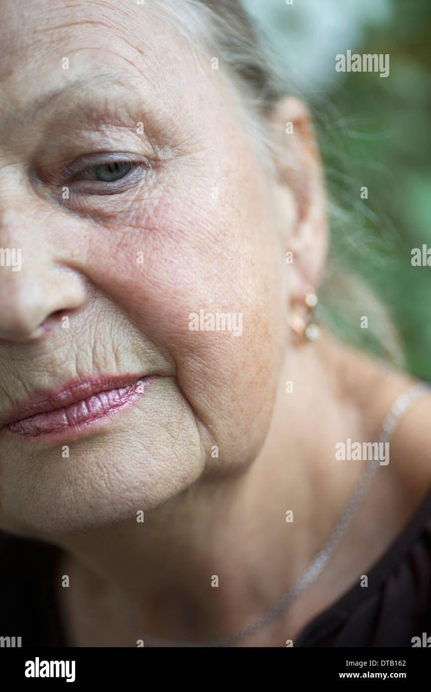 Senior woman looking down, close-up Stock Photo