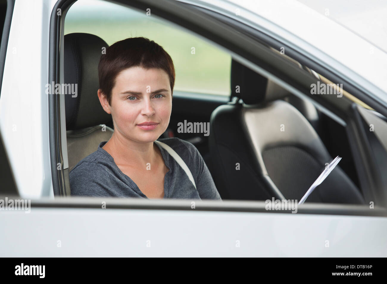 Portrait of mid adult woman sitting in car Stock Photo