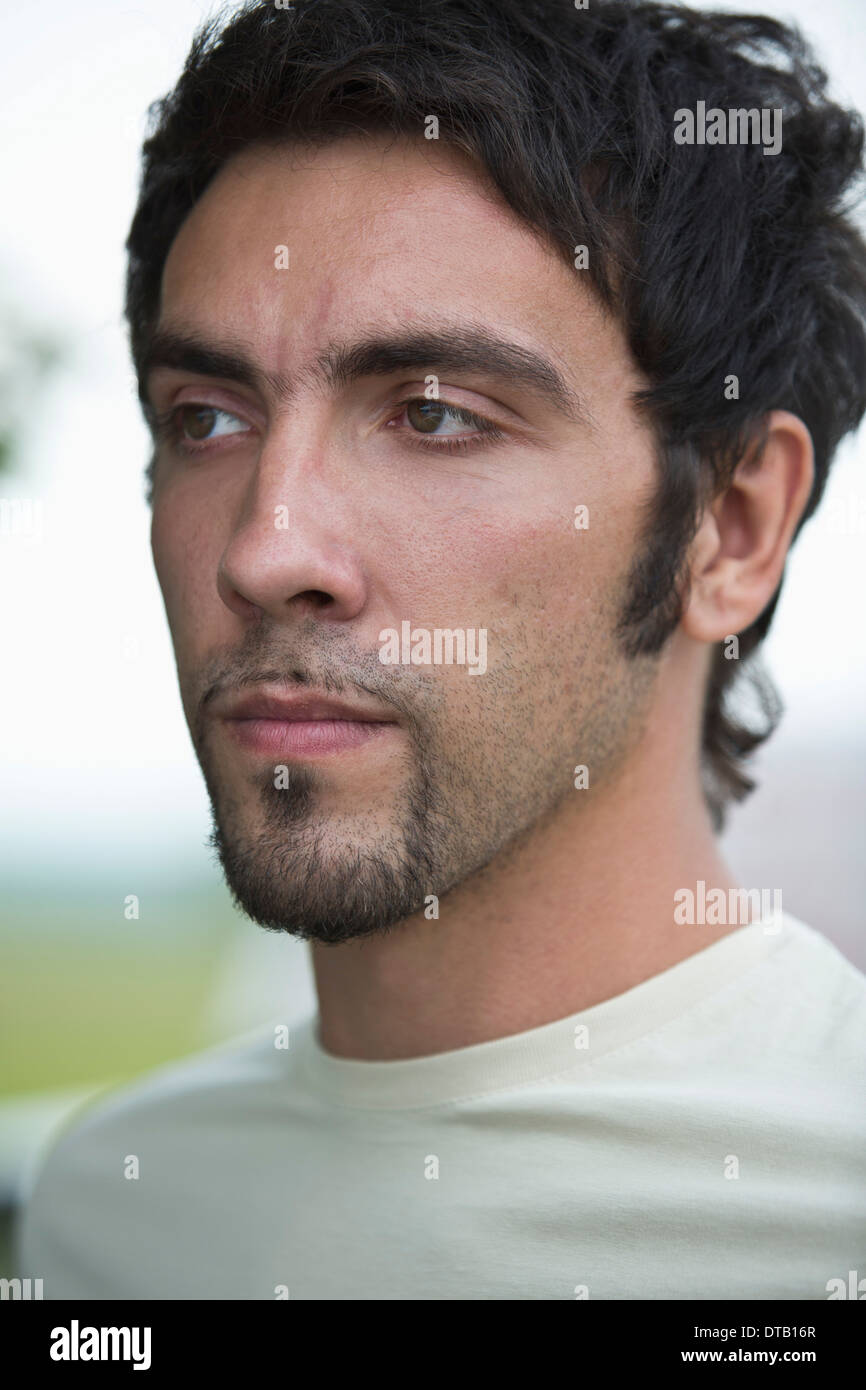 Young man looking away, close-up Stock Photo