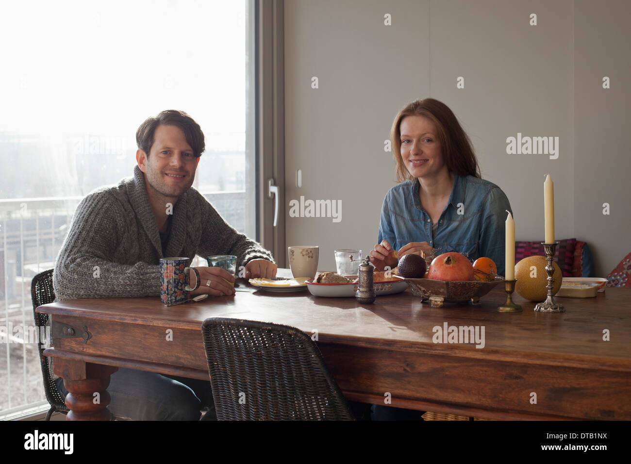 Couple having breakfast at dining table, portrait Stock Photo