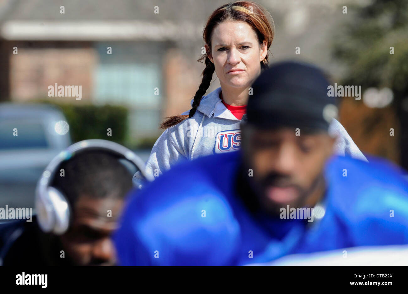 Feb. 13, 2014 - Allen, TX, United States of America - Jennifer Welter waits for her turn to participate in a drill during practice Thursday, February 13, 2014, in Allen, Texas. The 5-foot-2-inch, 130 pound Welter is the first woman to try out for a professional football team at a position other than kicker, she is trying to make the Texas Revolution of the Arena Football League, as a running back. Stock Photo