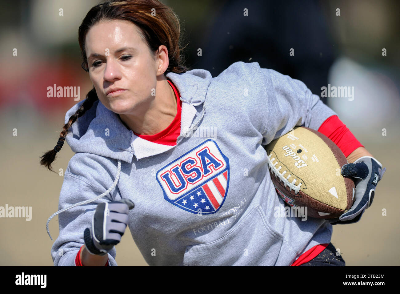 Feb. 13, 2014 - Allen, TX, United States of America - Jennifer Welter participates in a drill during practice Thursday, February 13, 2014, in Allen, Texas. The 5-foot-2-inch, 130 pound Welter is the first woman to try out for a professional football team at a position other than kicker, she is trying to make the Texas Revolution of the Arena Football League, as a running back. Stock Photo