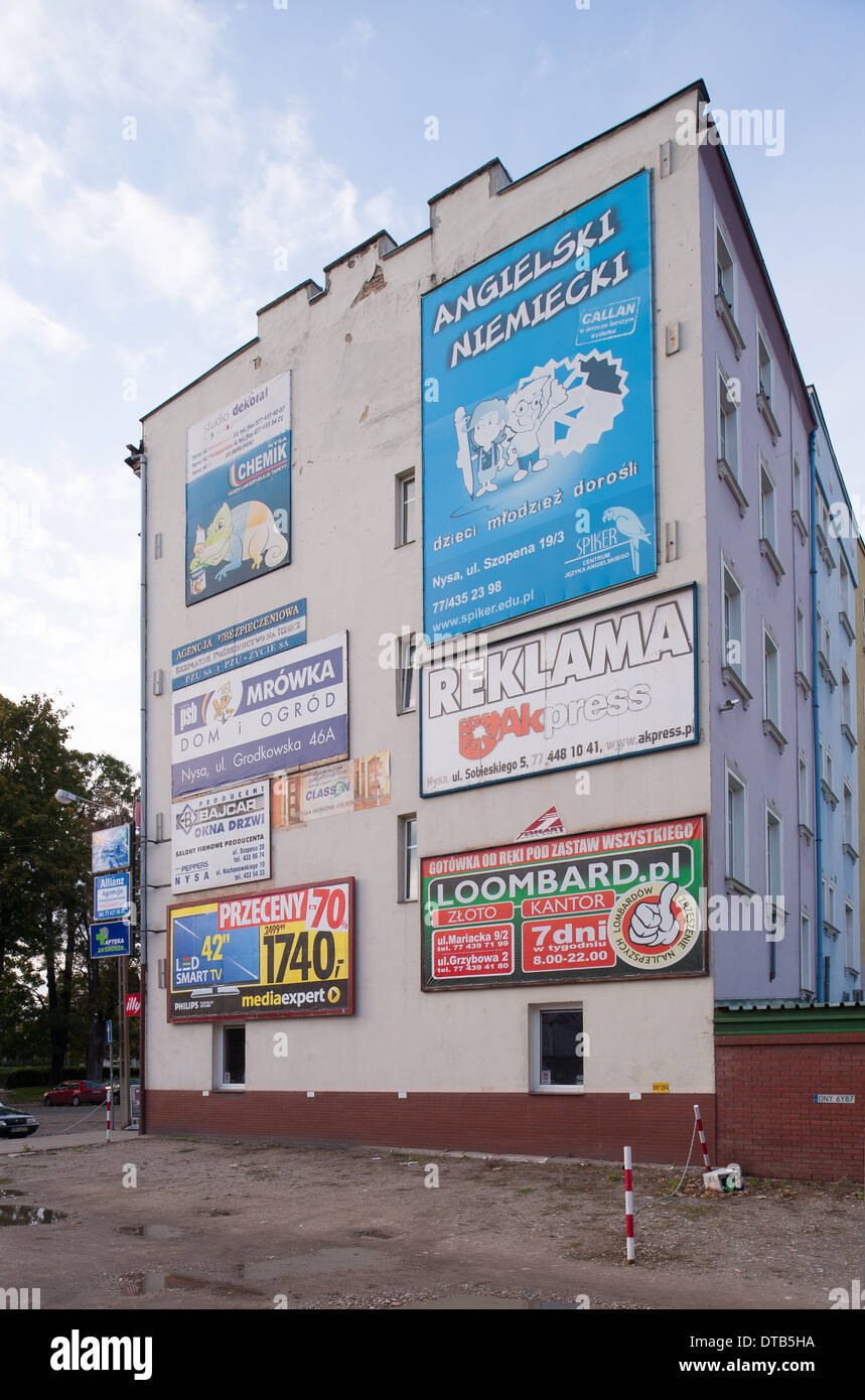 Nysa, Poland, house wall with various advertising posters Stock Photo