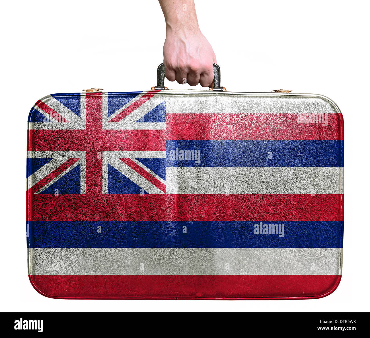 Tourist hand holding vintage leather travel bag with flag of Hawaii