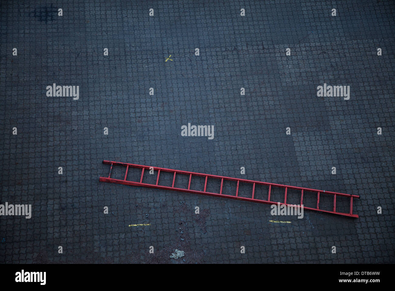Ladder on dirty floor Stock Photo