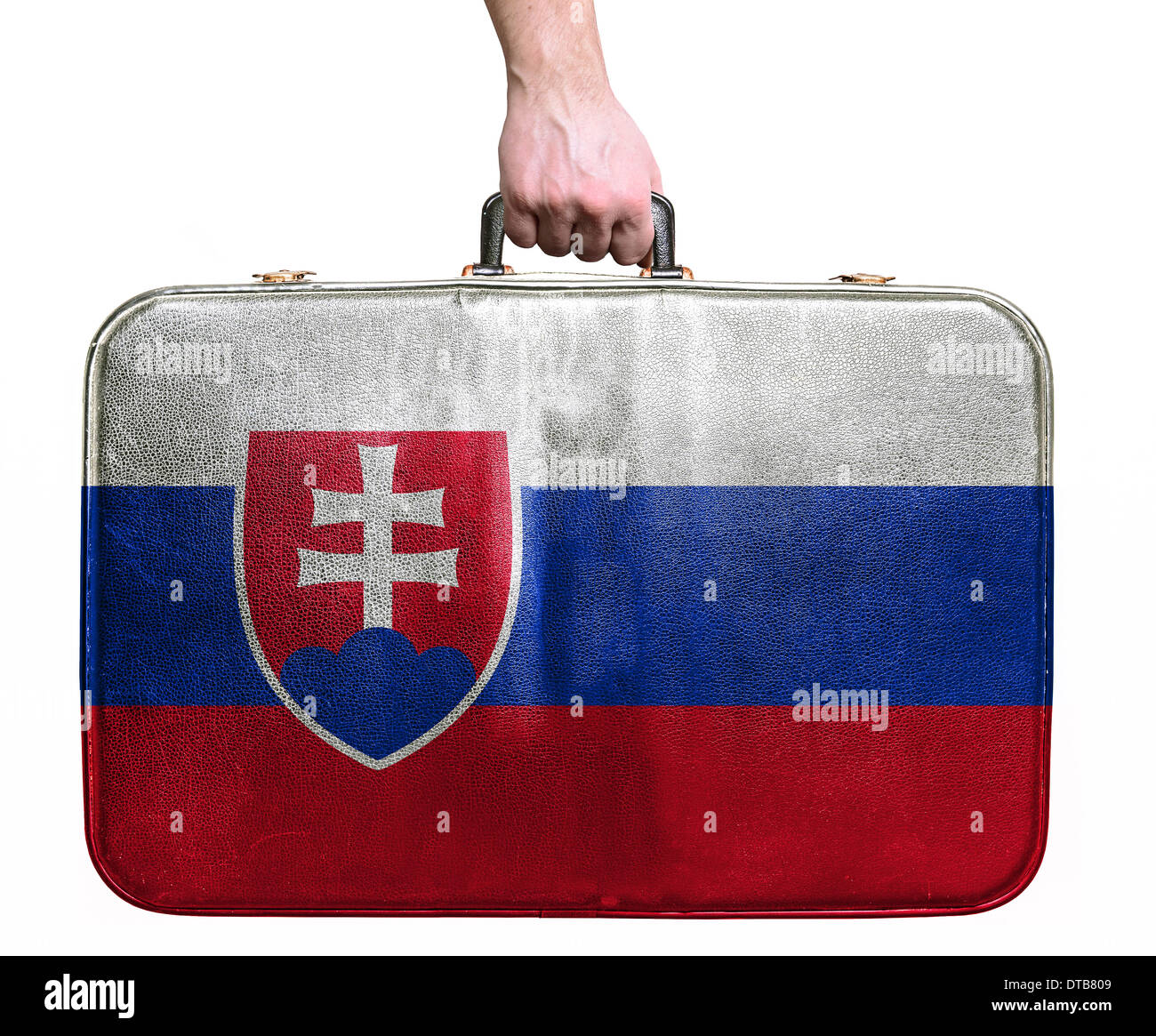 Tourist hand holding vintage leather travel bag with flag of Slovakia