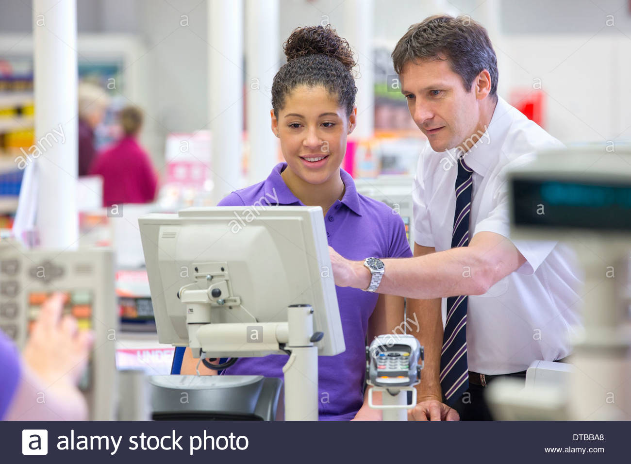 Supermarket Manager Training Cashier At Checkout Stock Photo: 66633232 ...