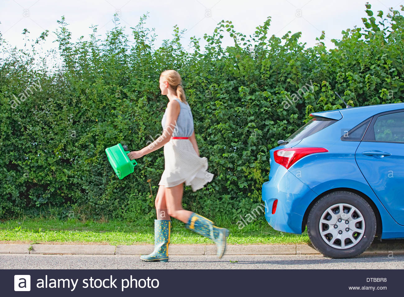 Woman Running Out Of Fuel On Country Road Stock Photo 66633596 Alamy
