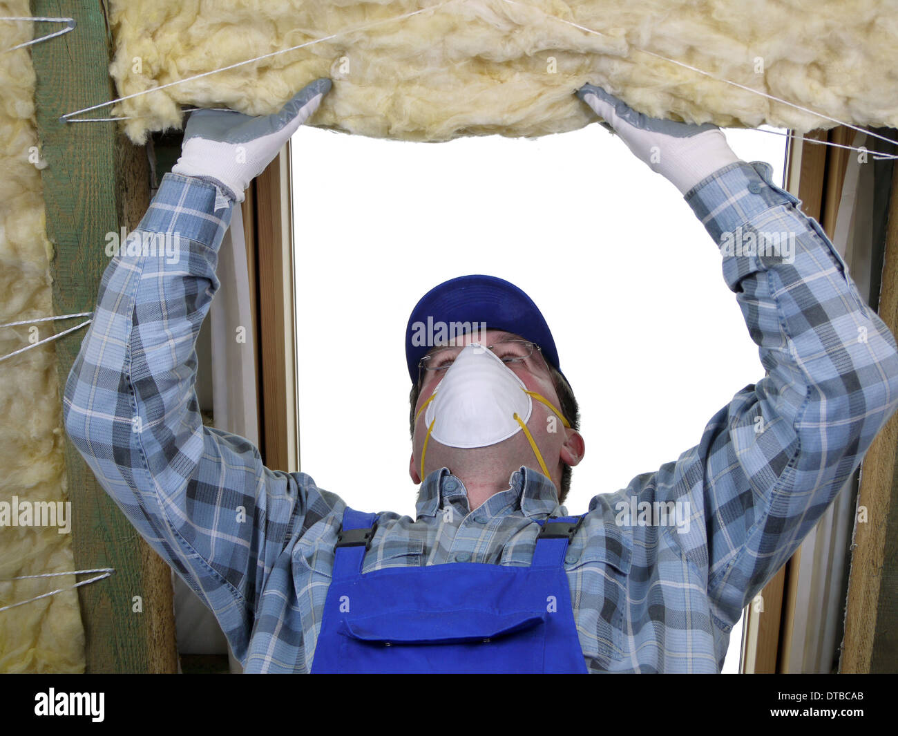 Worker thermally insulating a house attic using mineral wool Stock ...