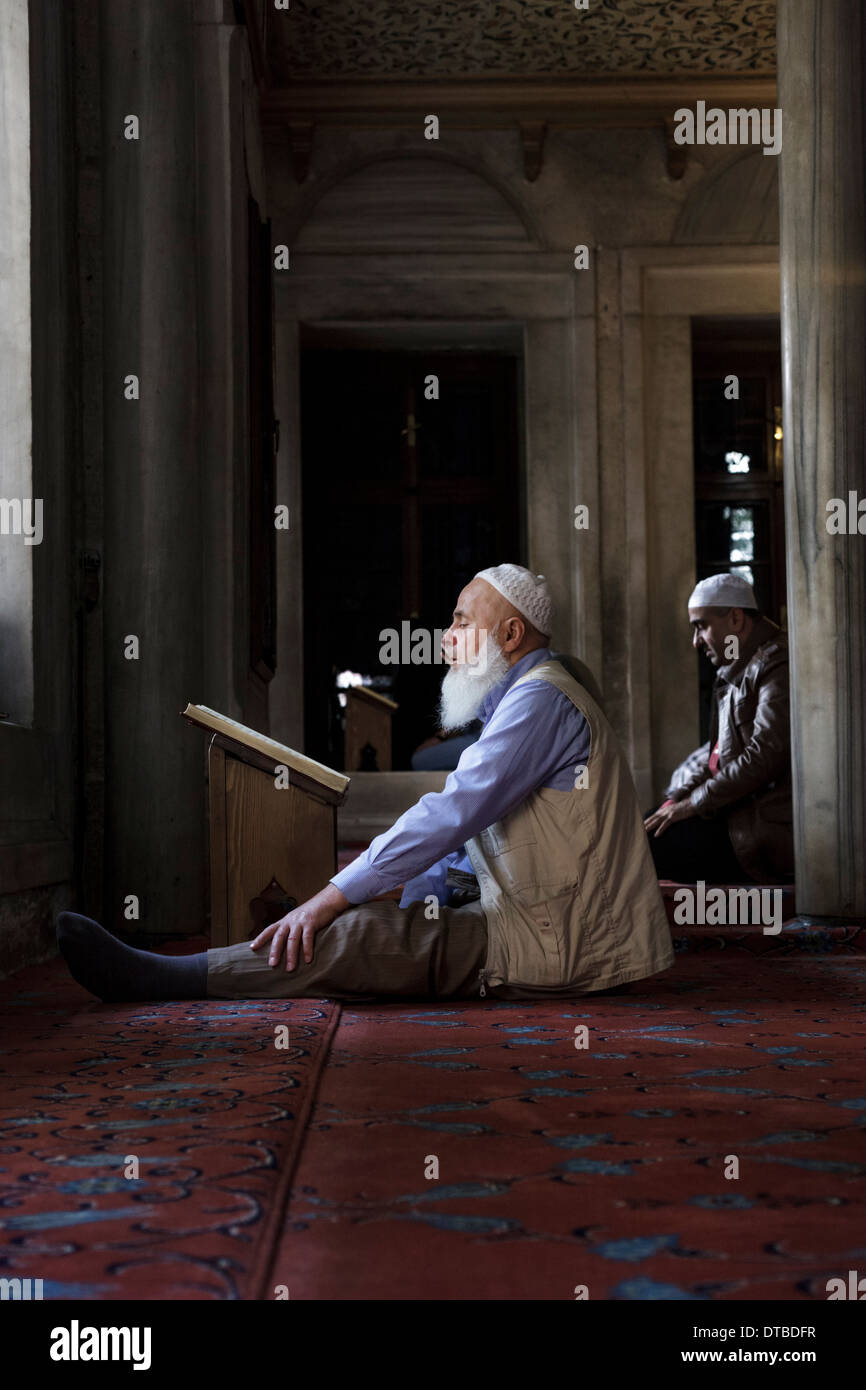 A man is seen praying in Eyub Mosque Stock Photo
