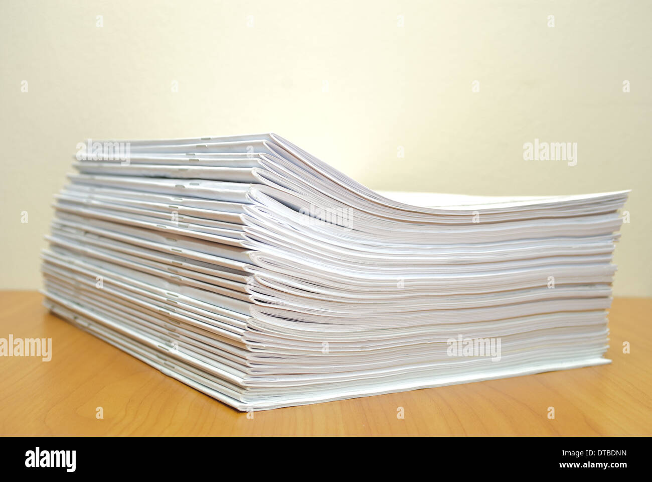 Stack of white journals in office desktop. Shallow deep of field Stock ...