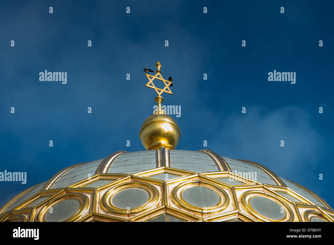 Berlin, Germany , Spire of the New Synagogue in Oranienburger Strasse with jackdaws Stock Photo
