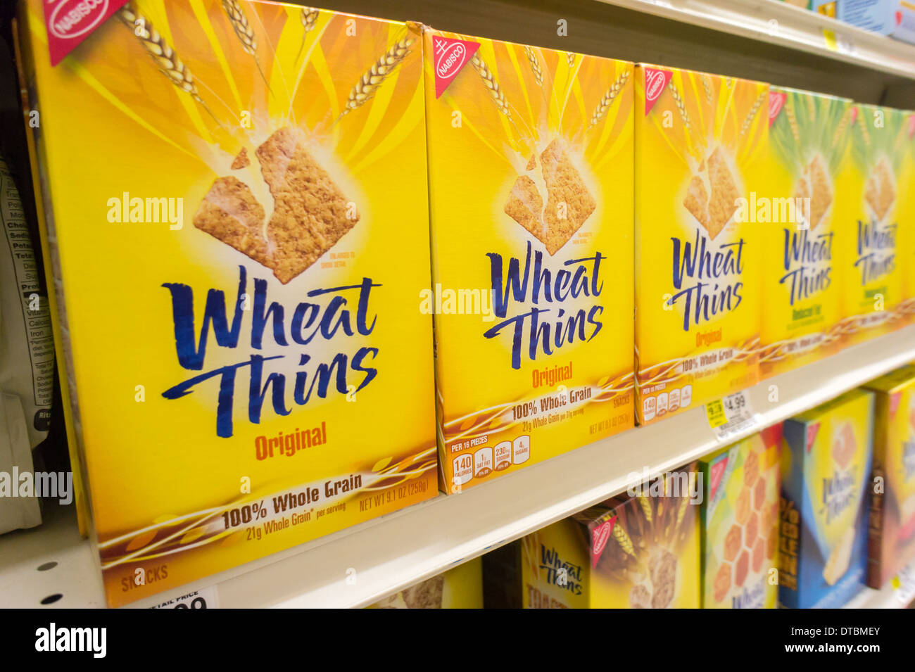 Boxes of Mondelez International Wheat Thins on a supermarket shelf in