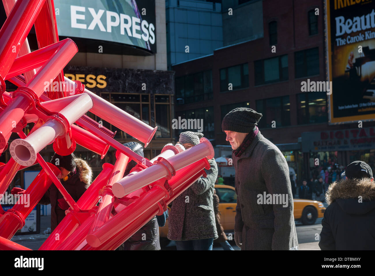 Viewers peer through the periscopes of 'Match-Maker', created by the design studio Young Projects, in Times Square in New York Stock Photo