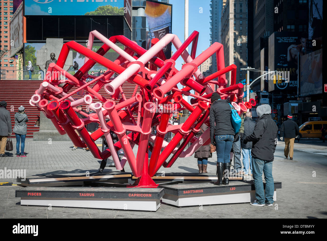 Viewers peer through the periscopes of 'Match-Maker', created by the design studio Young Projects, in Times Square in New York Stock Photo