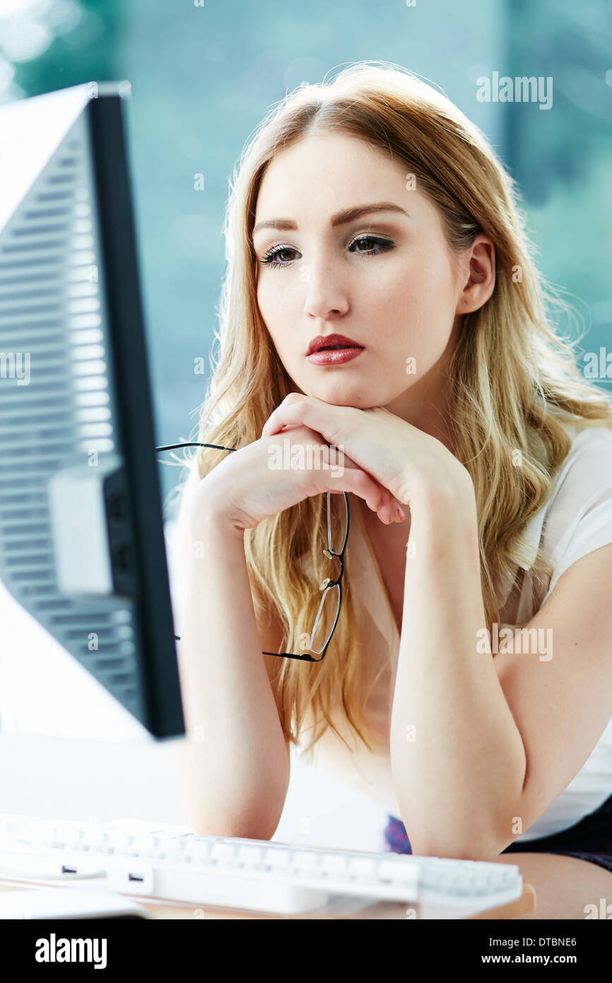 Girl stressed at work Stock Photo