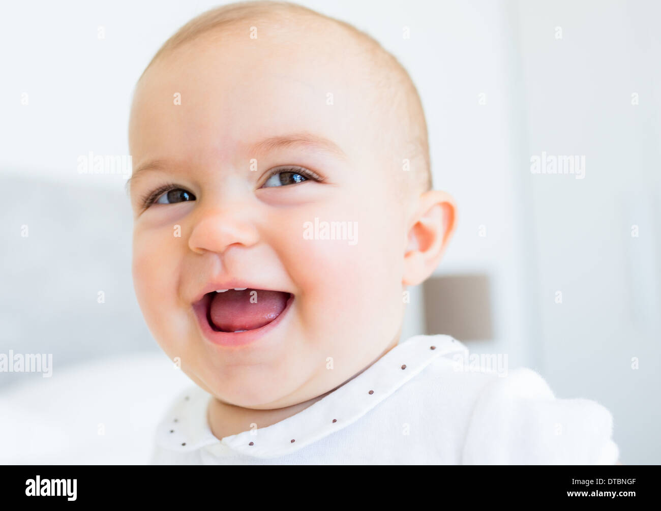 Closeup portrait of a smiling cute baby Stock Photo