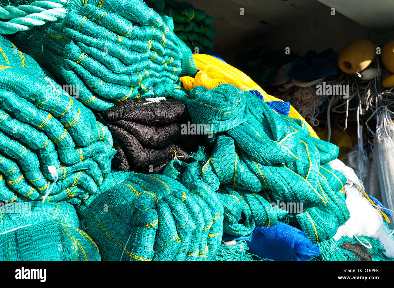 Fishing nets lying in the sunlight Stock Photo - Alamy
