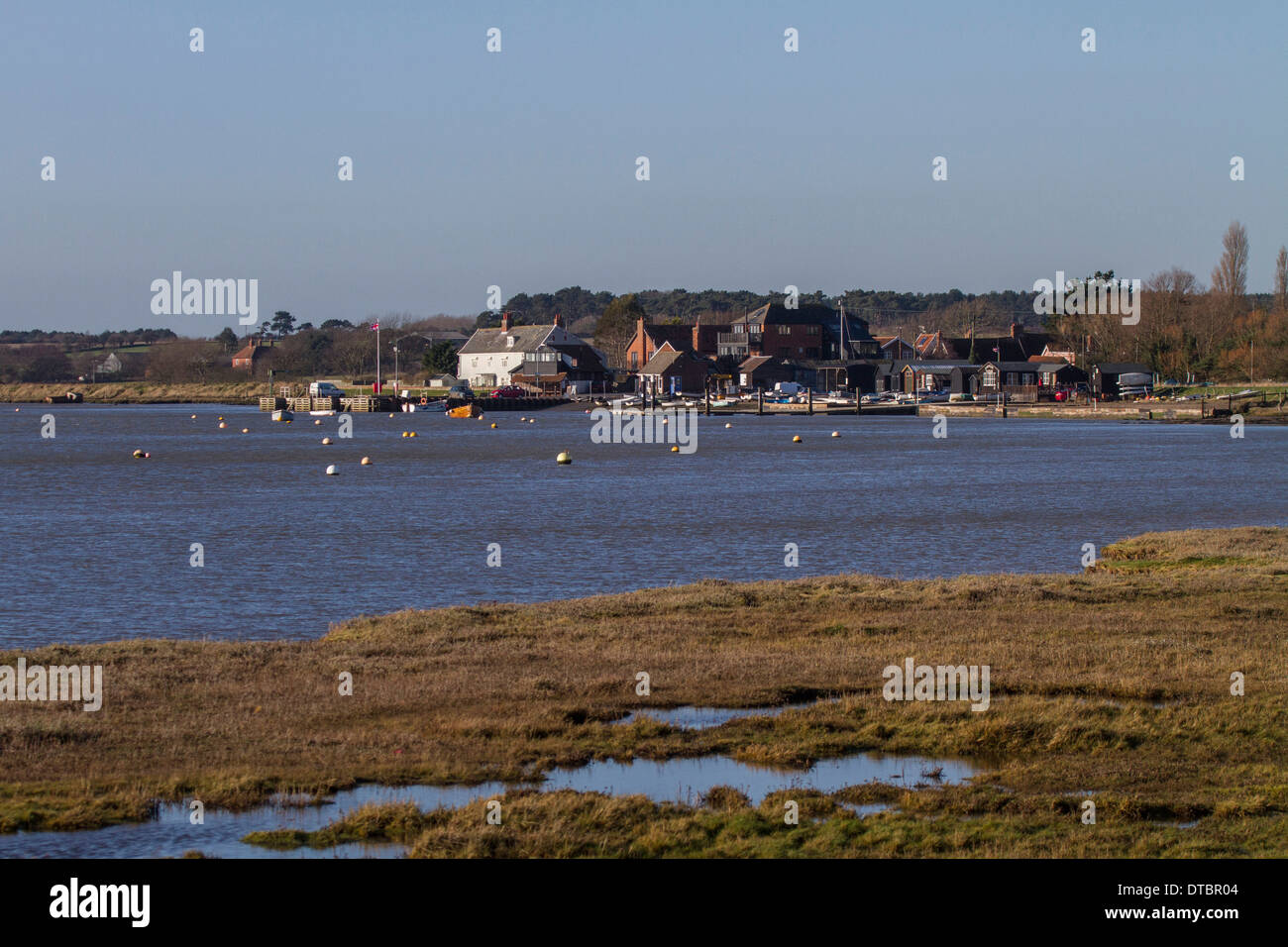 Looking south to Orford,Quay. on the River Alde with tidal salt marsh. Suffolk. Stock Photo