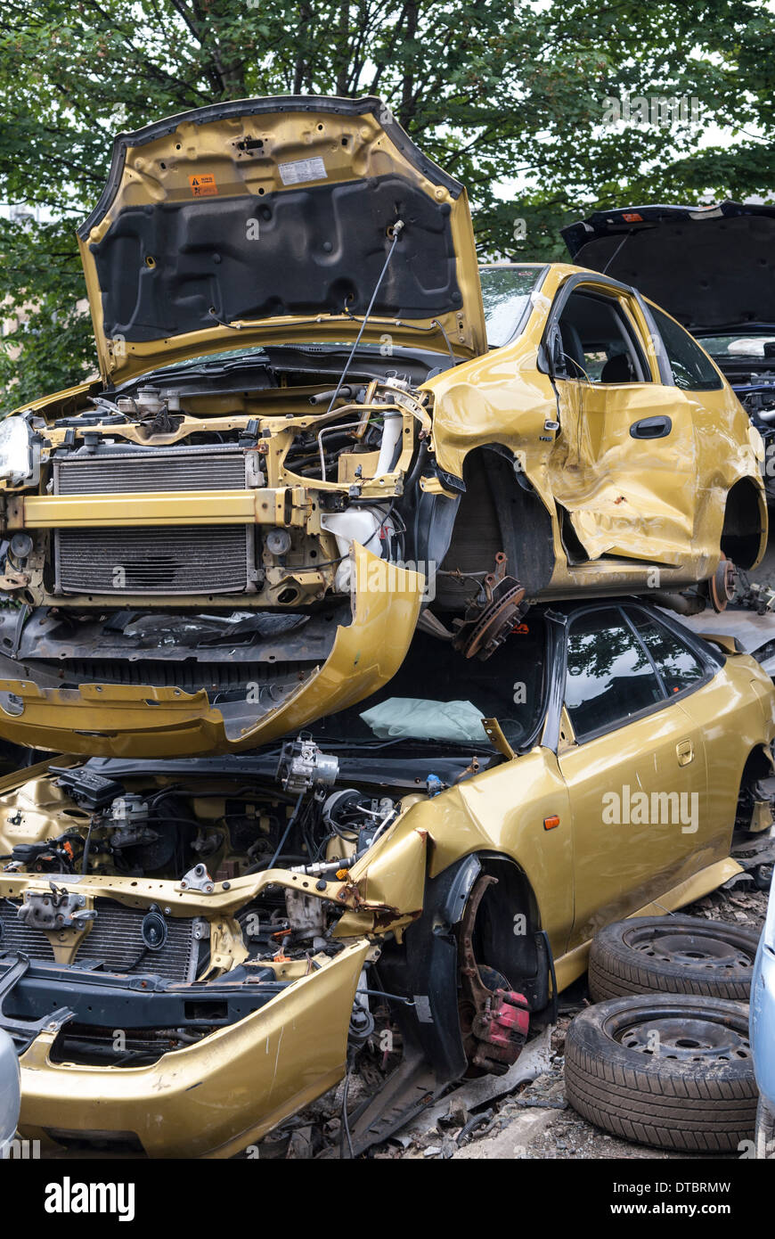 Crushed cars in scrap yard UK Stock Photo Alamy