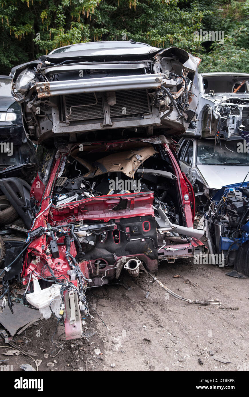 Crushed cars in scrap yard UK Stock Photo Alamy