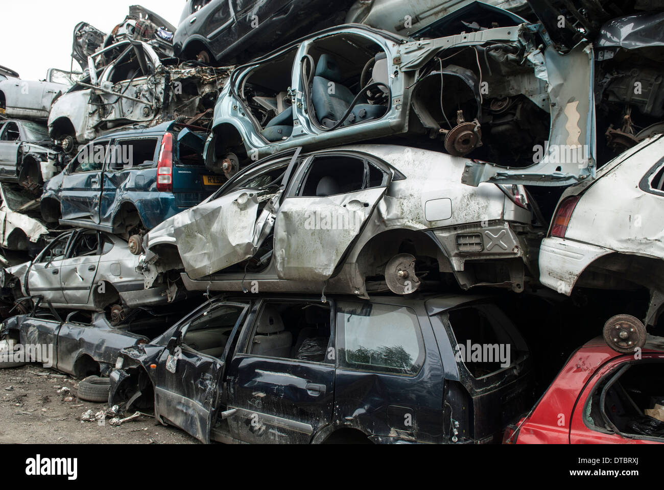 Crushed cars in scrap yard UK Stock Photo Alamy