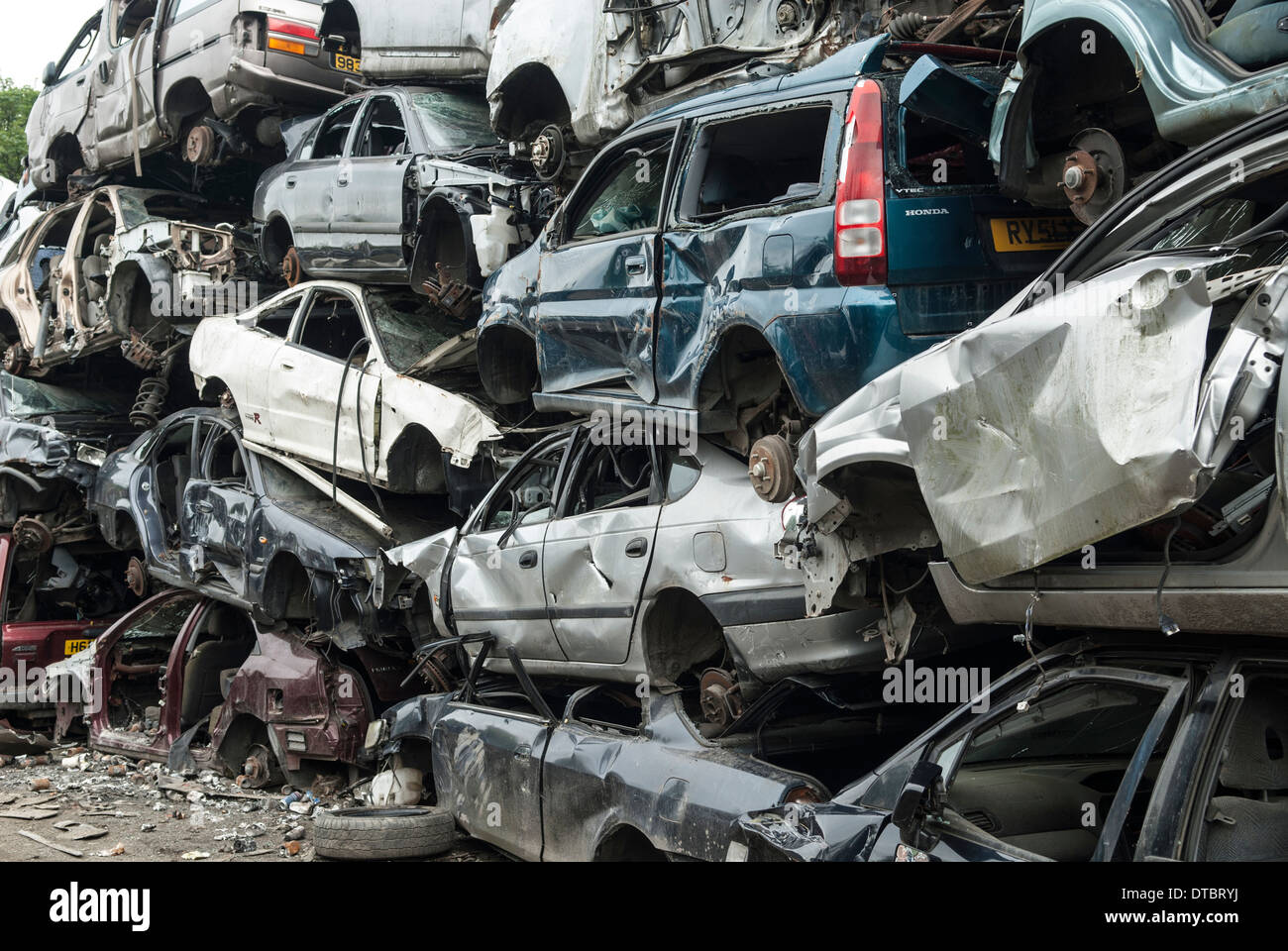Crushed cars in scrap yard UK Stock Photo Alamy