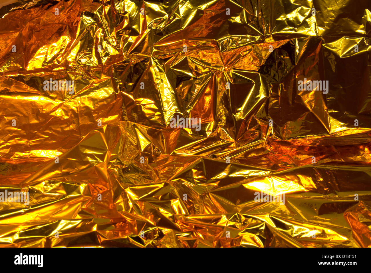 full frame creased gold foil background Stock Photo