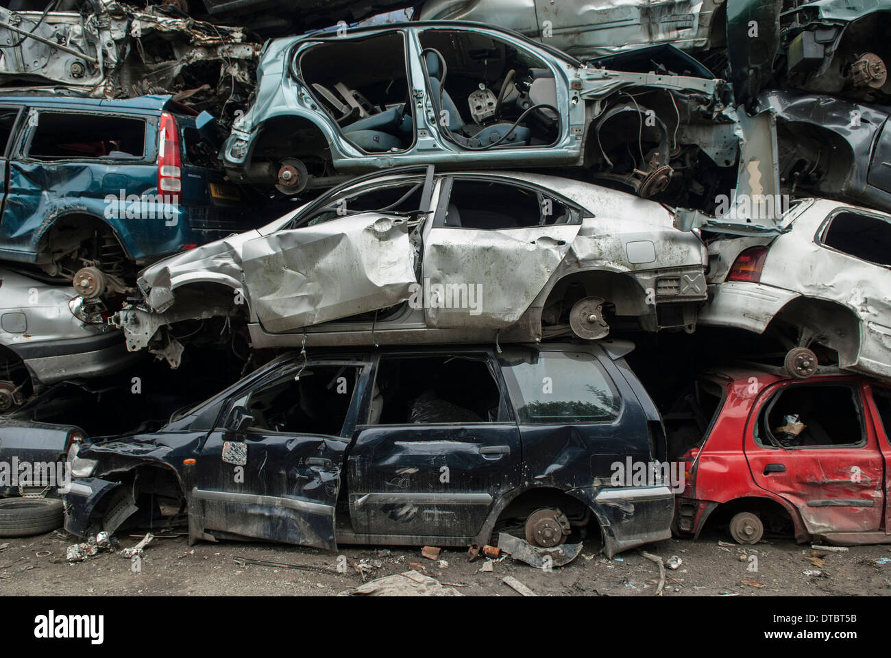 Crushed cars in scrap yard UK Stock Photo Alamy