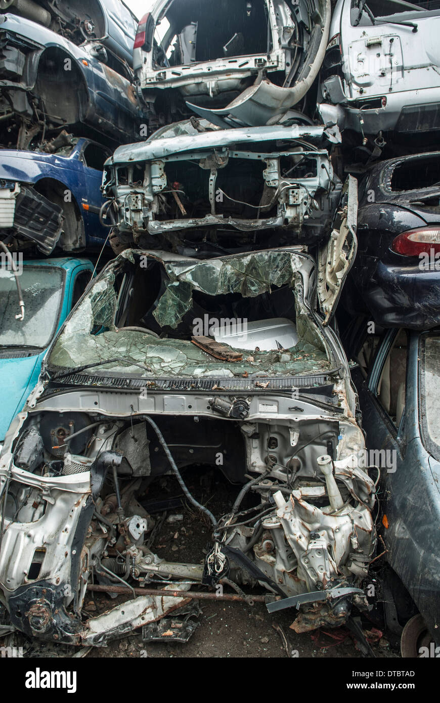 Crushed cars in scrap yard UK Stock Photo Alamy
