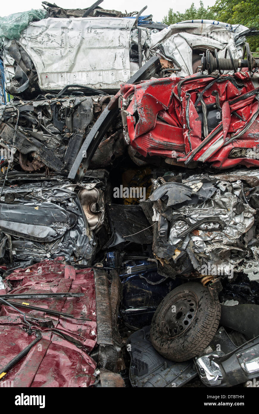 Crushed cars in scrap yard UK Stock Photo Alamy