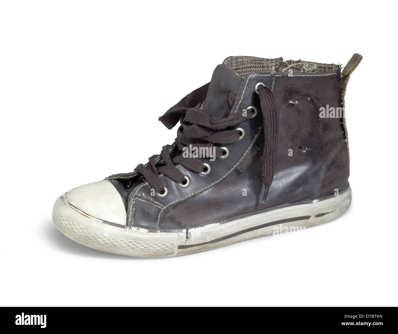 a old brown sneaker in white back Stock Photo