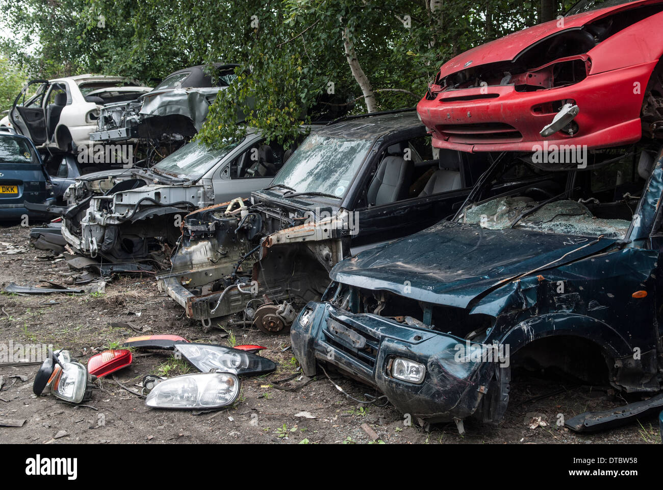 Crushed cars in scrap yard UK Stock Photo Alamy