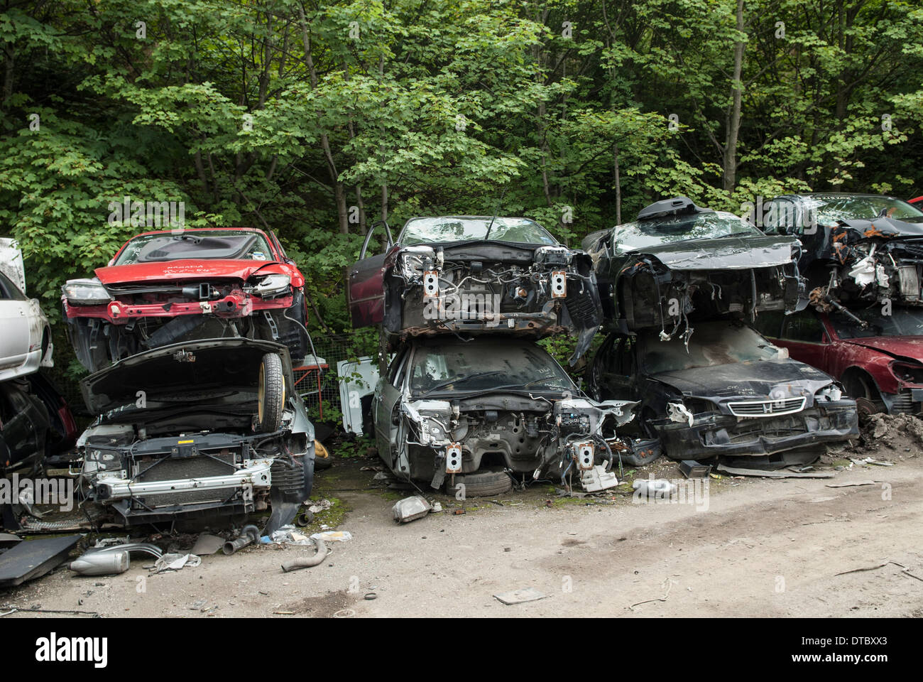Crushed cars in scrap yard UK Stock Photo Alamy