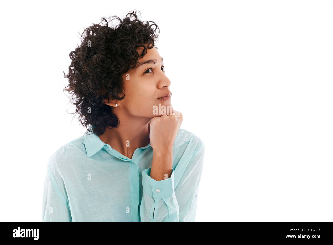 Portrait of confused and uncertain hispanic business woman on white background Stock Photo