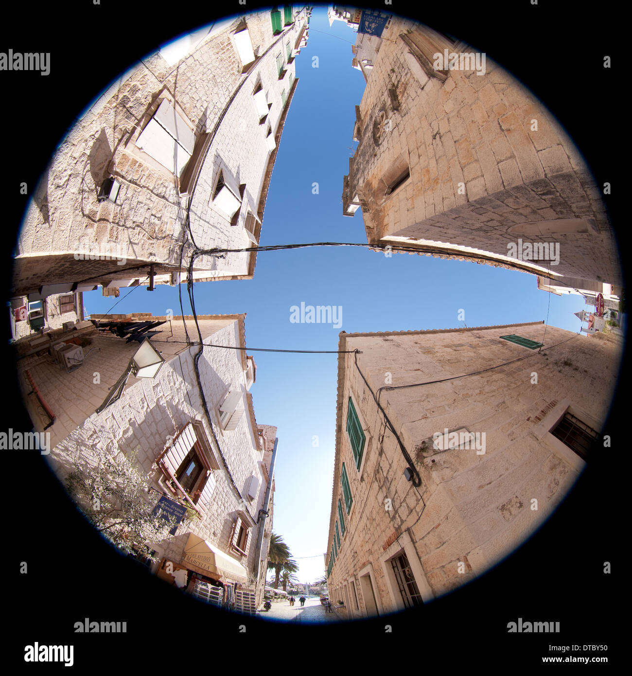 At a crossroad looking up with 360 degree view Stock Photo