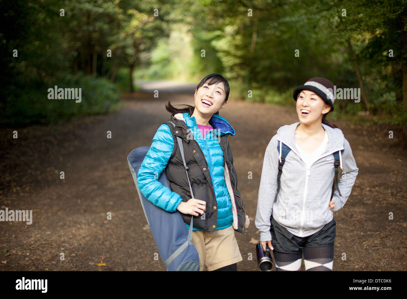 Two young female hikers on country road Stock Photo - Alamy